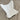 White butterfly chair on a wooden floor