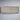 Long rectangular cushion on a white wall