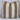 Two striped pillows with brown and beige stripes on a white surface.