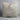Beige pillow on a white background