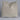 Beige pillow on a light gray background