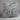 Decorative pillow with leaf pattern on a plain background