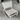White metal chair on a concrete floor